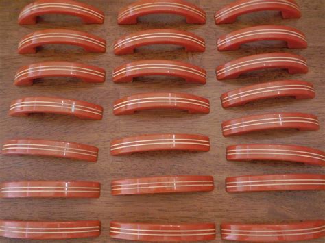 When was bakelite used in cabinet hardware, and how did it influence the design of modern kitchen utensils?